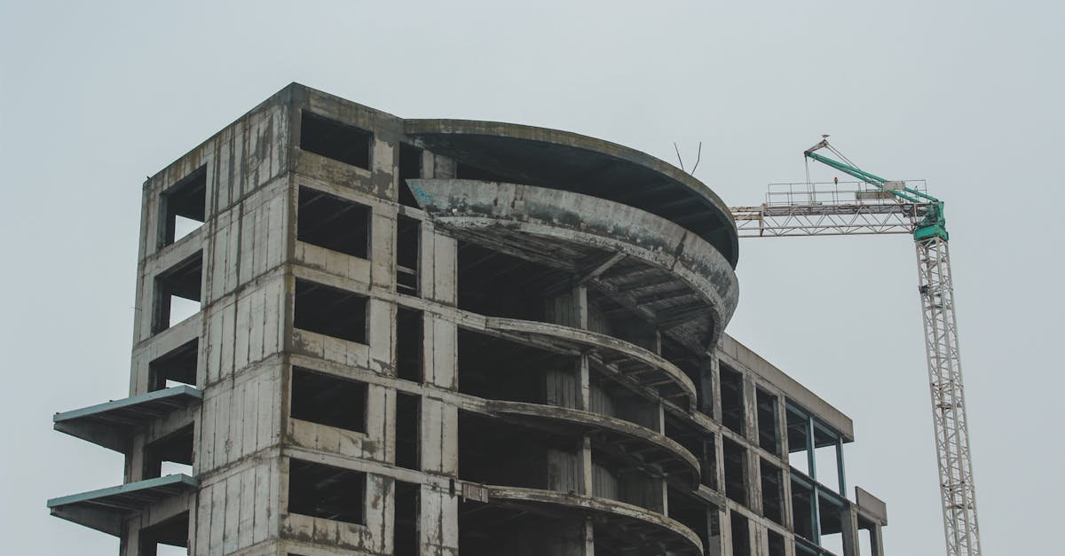 A high-rise building under construction with a crane, showcasing modern architecture in Constanța, Romania.