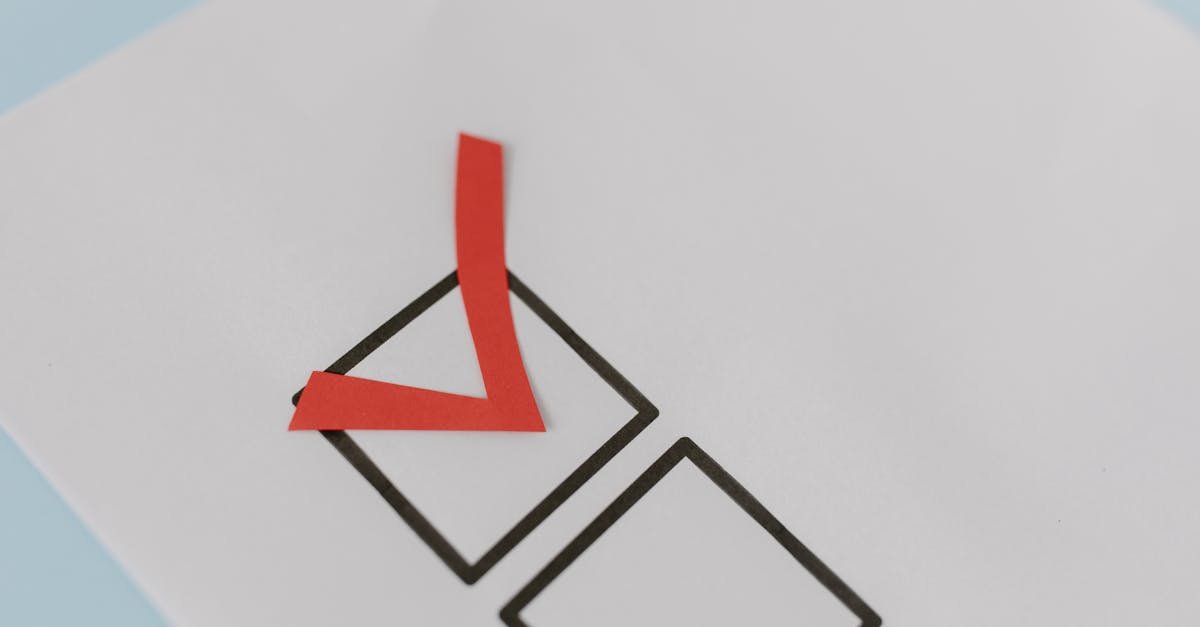 Close-up of a red check mark on a crisp white paper with black boxes, symbolizing completion.